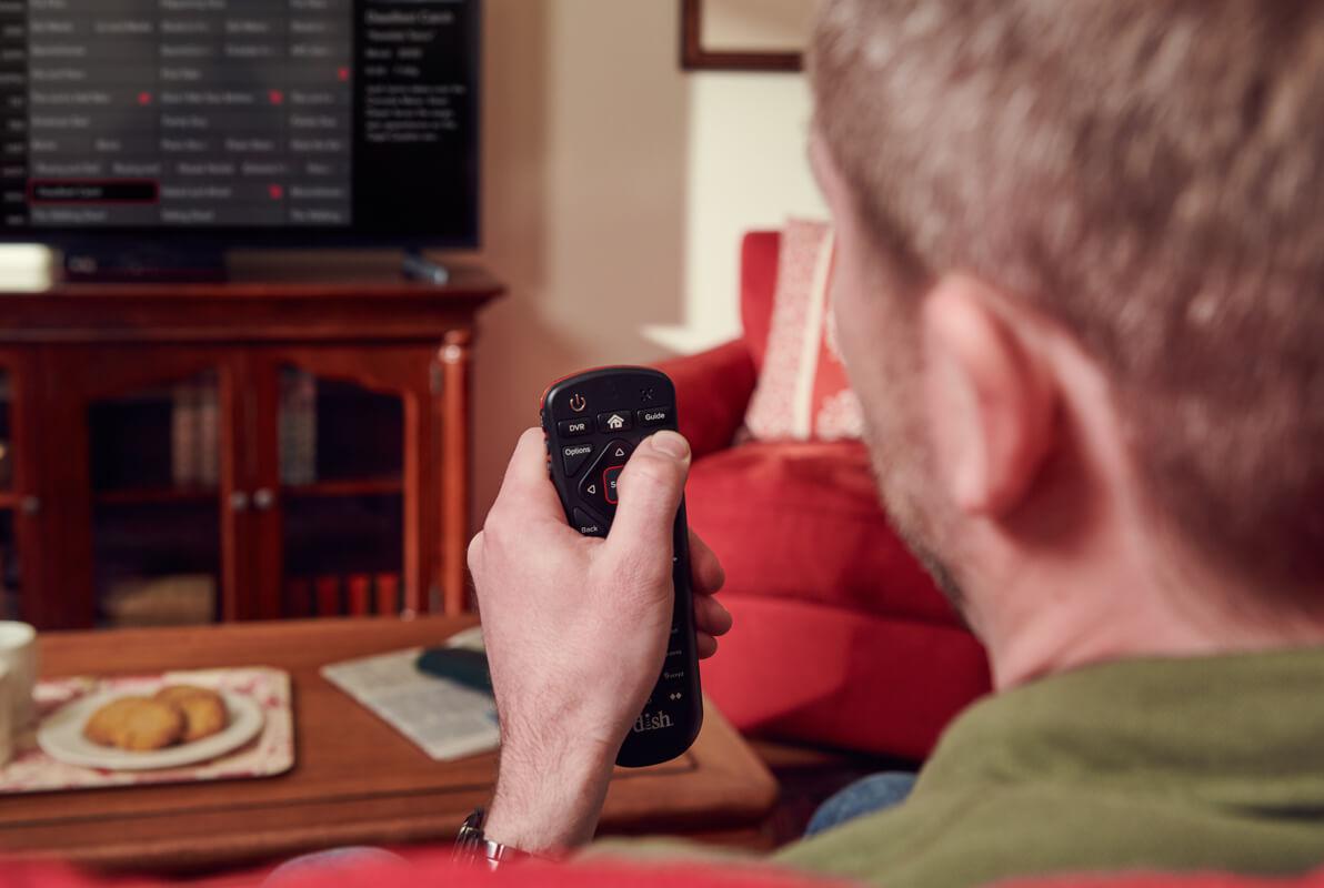 Guy Using Voice Remote on the TV